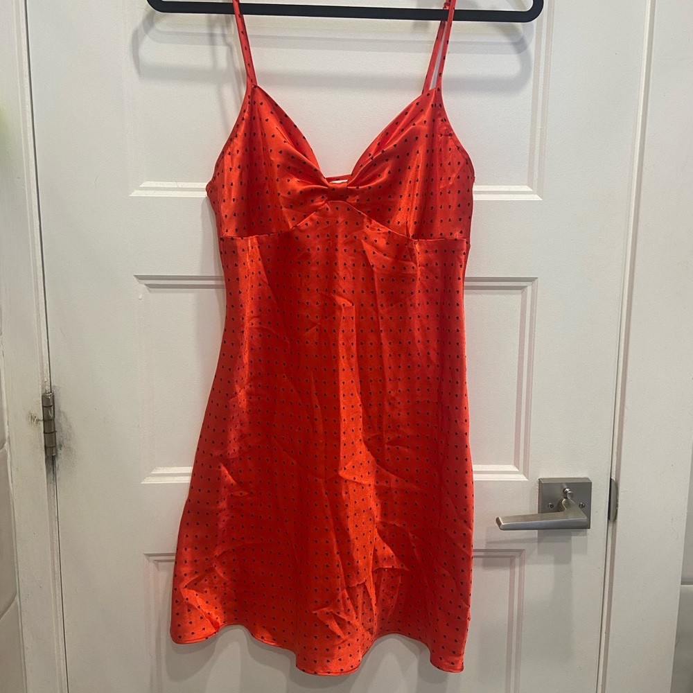 satin effect slip dress with black heart pattern